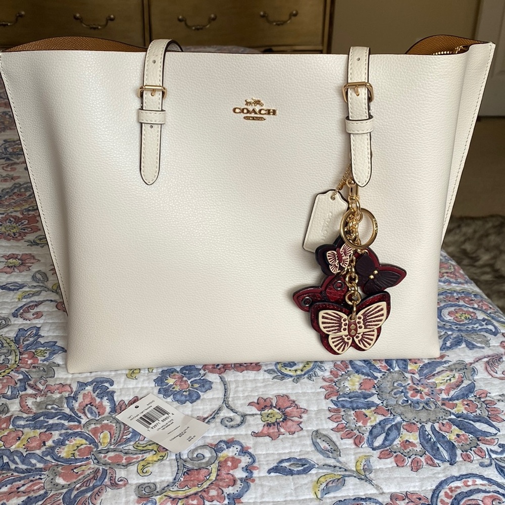 Brand new Coach tote with beautiful butterfly key chain
